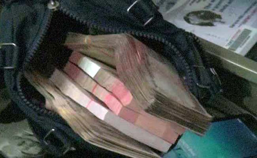 Assets worth over Rs. 60 lakh and cash worth Rs. 7 lakh, hidden under the bed, was found in a raid at the home